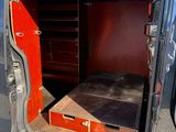 a van that has a bed in the back of it
