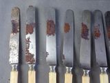 five knives that are sitting next to each other on a table