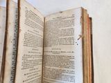 an open book that is sitting on a table
