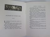 an open book with a picture of a flower on it