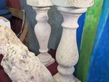 two white vases sitting next to each other on a table