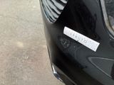 a sticker on the front of a black car