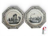 deux assiettes sur lesquelles figurent une ville et un château