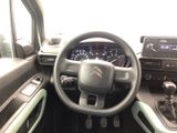 a picture of a car dashboard with a steering wheel