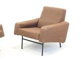 pair of mid - century lounge chairs with upholstered arms and legs