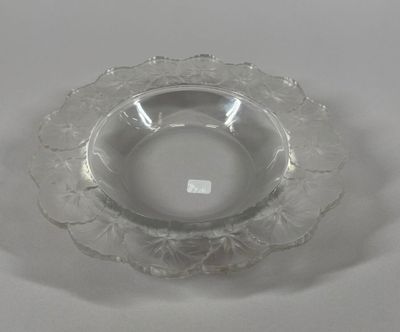 a clear glass bowl with a flower design on it