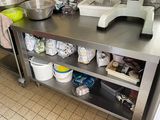 a kitchen counter with a mixer and a bowl on it