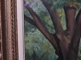 a picture of a painting of a tree in a room