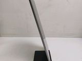 a tablet that is sitting on a stand on a table