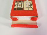 a small red box with a picture of a person on it
