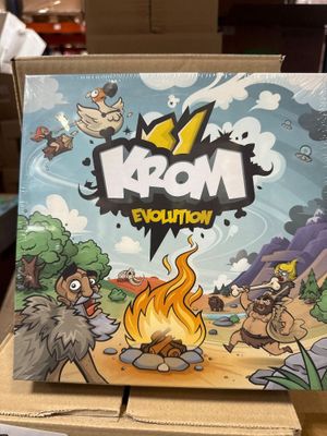 une image représentant une boîte sur laquelle figure un jeu, posée sur une table