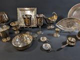 a table with a lot of silver items on it