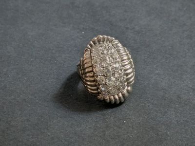 a close up of a ring on a table with a black background