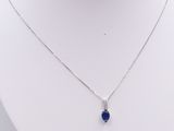 sterling silver necklace with a blue stone pendant on a white mannequin