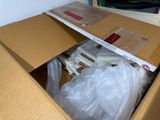 a cardboard box with a bunch of items inside of it
