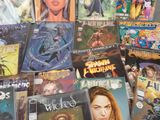 a lot of comic books on the table together