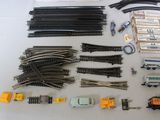 a lot of toy train tracks and other toy trains