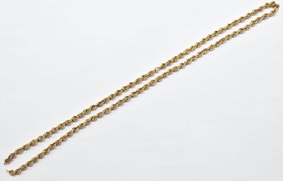 a gold necklace with a chain that is attached to it