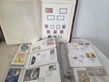 a lot of stamps on a table with a book
