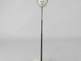 a white lamp with a white base and a white cord