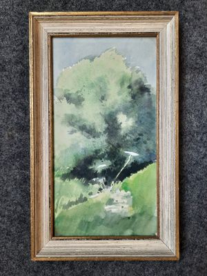 une photo d'un tableau représentant un arbre, encadré et accroché au mur