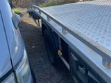 a truck that is parked next to another truck