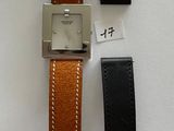 three different types of watches are displayed on a white surface