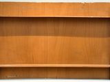 an image of a wooden book shelf with two shelves above it