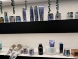 many different types of skin care products displayed on a shelf