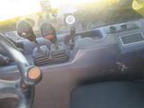 a close up of a car dashboard with a steering control