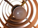 a light that is sitting inside of a wooden structure