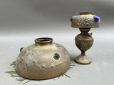 two vases sitting next to each other on a table