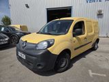 the yellow van is parked in front of a building