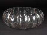 a clear glass bowl that is sitting on a table