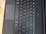 two laptops that are sitting on a wooden table