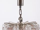 chandelier made of glass and metal with a metal frame