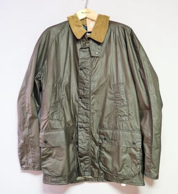 an image of a jacket hanging on a hanger on a wall