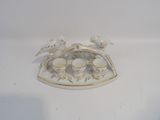 a tray with cups and birds on it on a table
