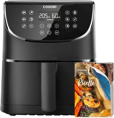 a black air fryer sitting next to a packet of pasta