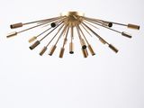 an image of a gold chandelier hanging from the ceiling