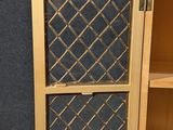 a wooden cabinet with a glass door on it