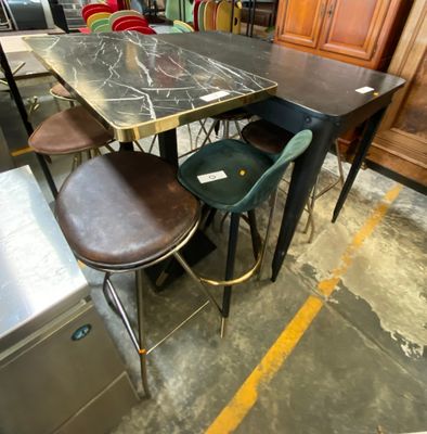 a table with four chairs and a refrigerator in the background