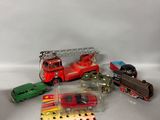 a lot of toy cars and a train on a table