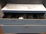 a picture of a bathroom vanity with two sinks and drawers