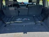 a trunk of a car with the back seats folded down