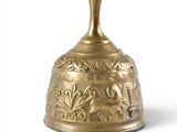 an old brass bell on a white background with a white background