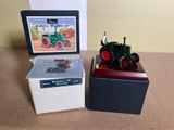 a small box with a picture of a man on a tractor on it