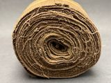 a roll of jute twine on a gray surface