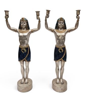 pair of egyptian figurines of a man and a woman