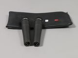 a pair of black binoculars sitting on top of a black case